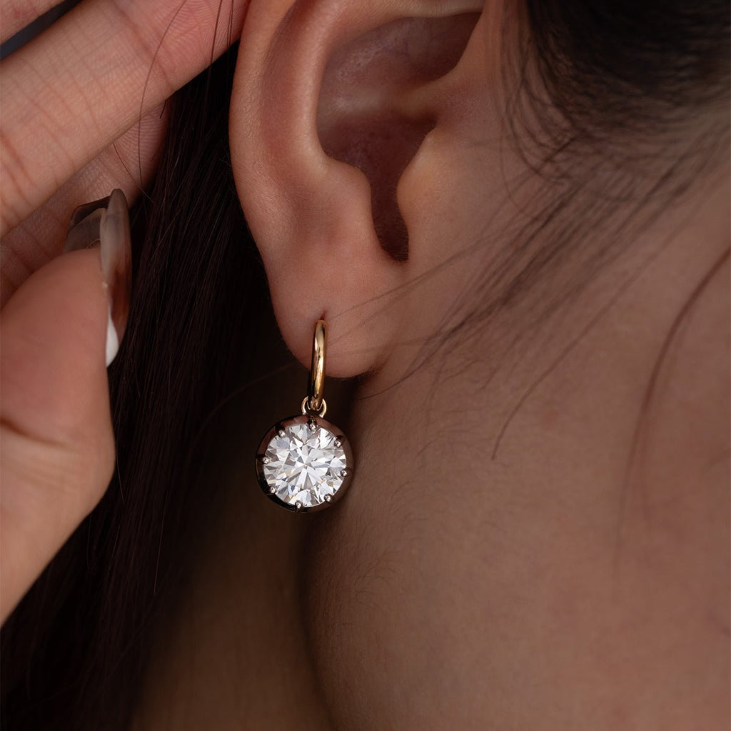 Elegant round-cut single 3-carat diamond two-tone hemispherical bezel-set pendant earrings