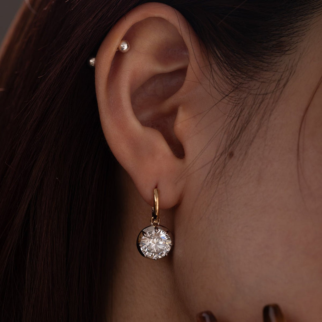 Elegant round-cut single 3-carat diamond two-tone hemispherical bezel-set pendant earrings